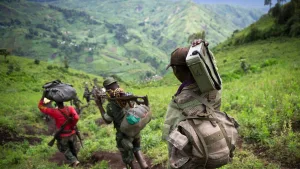 This picture taken on November 30, 2012 shows M23 rebels withdrawing through the hills having left their position in the village of Karuba, eastern Democratic Republic of Congo. Congolese troops on November 4, 2013 drove M23 rebels from one of the steep hilltops where they have holed up after being driven from their last stronghold in the east of the country, a senior official said. The army has "completely conquered" the Mbuzi hilltop after pounding rebel positions in the mountainous region